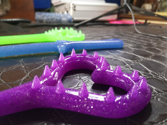 Broken hearted spiked polyurethane (flexible) marking paddle